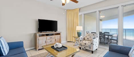 Living Room | Breathe Easy Rentals - Great living room area to enjoy while having friendly or family conversations, watching a little tv, all the while looking out over the beautiful Gulf.