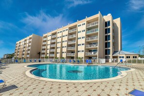 Dive into relaxation at our heated pool! Enjoy plenty of lounge chairs, a dedicated children's pool, and direct beach access just steps away.