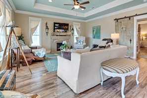 A living room that blends high-end design with cutting-edge entertainment technology