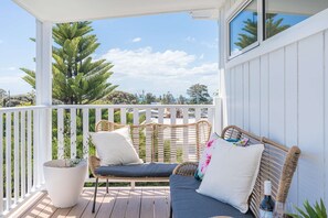 Elevated back deck with bay views