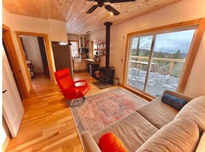 The living room with a recliner and king-size sleeper sofa — all with a view!