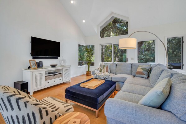 Cathedral ceilings with views of live oaks