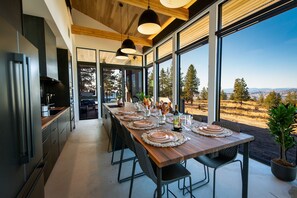 Open kitchen with floor to ceiling windows and expansive views