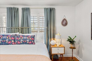 Enjoy the elegant King Bedroom. Try the light alarm clock and wireless charging pad.