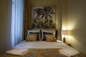 Experience ultimate comfort with our premium mattress and soft, high-quality cotton linens, all enhanced by a beautiful jungle decor painting that brings a touch of nature to your stay.