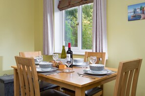 Courtyard garden views from the dining table seating four guests