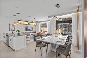 Open and integrated concept of living room, kitchen and dining space.