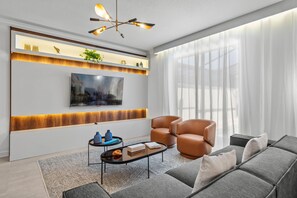 Living room with access to the pool.