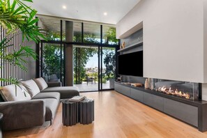 Gas log fireplace, with Smart TV. All doors open to the terrace