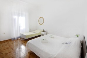 The bedroom with a double bed and a single bed