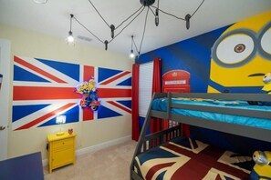 Delight in this vibrant Minion-themed room, complete with a Union Jack mural and cozy bunk beds, perfect for a fun family getaway!