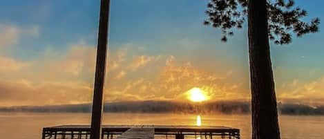 Enjoy stunning sunrises and lake adventures just steps from the back porch!