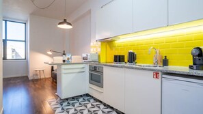 With modern appliances and tasteful design, our kitchenette is the perfect space to cook a delicious snack #practical #colorful