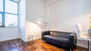 Discover the charm of our living area, adorned with unique accents and comfortable seating #contemporary #practical
