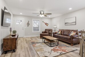 Leather Furniture and 65" TV in Family Room