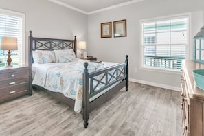 Drift into dreamland in our bedroom sanctuary, featuring a plush Queen bed and a smart TV
