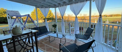 Enjoy your morning coffee in the back porch. The view of the pond is calming.