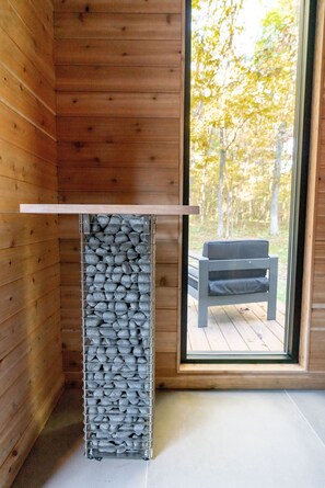 The heart of sauna is its ´kiuas´, or sauna stove/heater, We feature the HUUM Cliff 9.