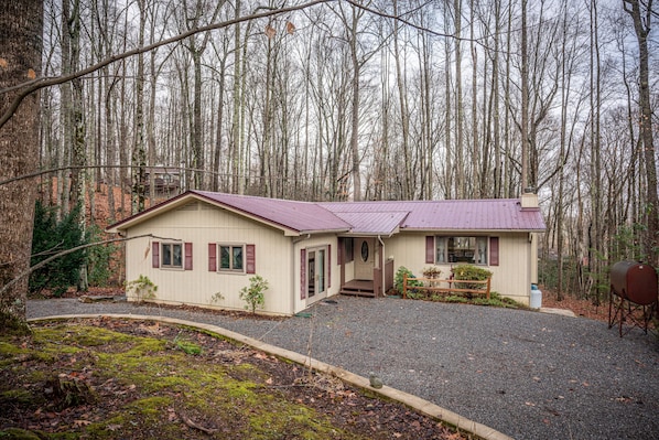 Paved roads to property, lower elevation. Secluded, yet close to area amenities.