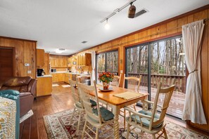 Dining Room table comfortably seats six with easy access to the grill on deck.