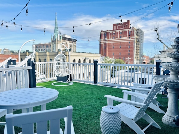 Rooftop Views for Days at The Savannah Peach Penthouse.