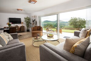 The Sheep Fold - comfortable sitting room with plenty of seating where you can relax after a busy day