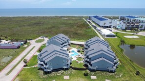Outdoors - Mustang Island Beach Club offers a heated pool, hot tub, and boardwalk to the beach.