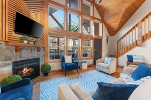 Step inside this stunning vacation rental home by Relax and Renew Rentals in Branson, MO. Soaring ceilings, warm wood finishes, and cozy fireplace vibes await—perfect for relaxing after a day exploring Silver Dollar City or Table Rock Lake in Branson!
