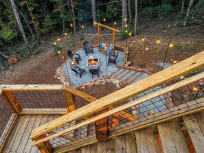 At the end of the day, head down the stairs to the wood-burning firepit...