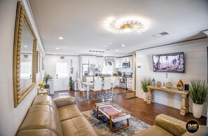 Stylish design enhances the room, highlighting easy access to online entertainment for guests.