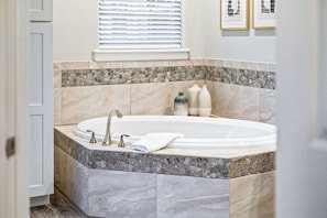 Soak and unwind in this luxurious Jetted tub in master bathroom.