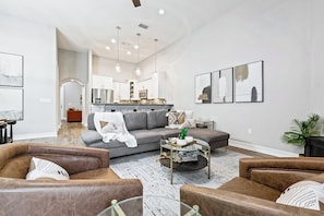Relax and connect in this cozy living space with plush seating, warm lighting, and an open layout perfect for gathering with family and friends.