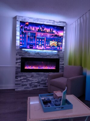 Enjoy Television with back light and ambiance of our colorful no-heat fireplace!