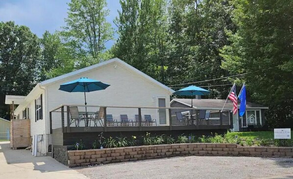 The front deck with a lovely view of the lake is perfect for meals and relaxing