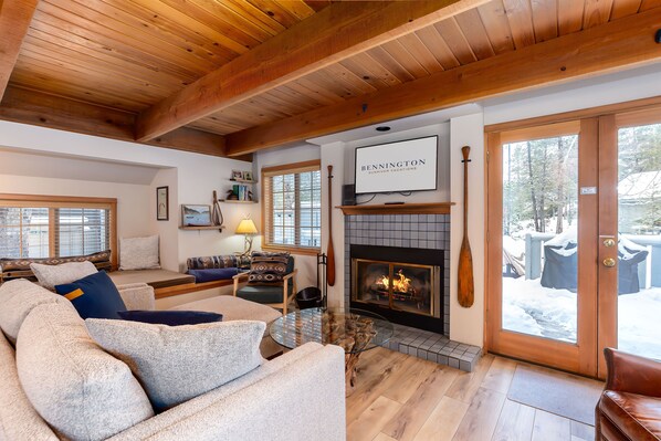 Living Room w/ TV and Wood Burning Fireplace