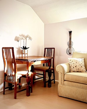 Sunny upstairs sitting room with table and chairs for work or creativity. 
