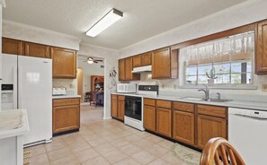 Spacious kitchen includes all full-size appliances and cooking utensils