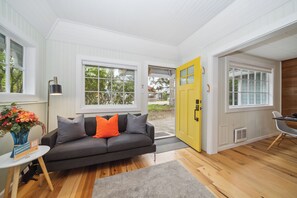 Open living/dining area with wood fireplace insert.