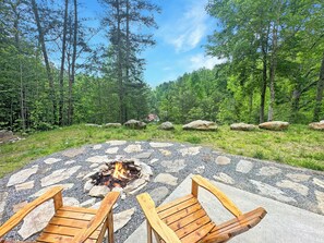 Just off the side of the hot tub is this beautiful mountain view and fire pit!