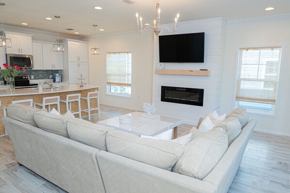 Your home away from home awaits with this stylishly designed space, featuring a seamless flow between the living room and fully equipped kitchen.