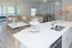 The blend of comfort and elegance in this spacious living and dining area, designed for memorable gatherings.