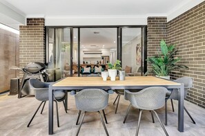 Dine alfresco while cooking up a feast on the BBQ. Sliding doors create a lovely transition between the indoors and out.
