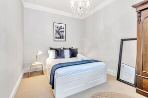 The classic bedroom is beautifully designed with a queen-sized bed and wardrobe space for storing your belongings.