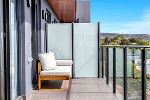 Outdoor seating on the balcony offers a peaceful spot to enjoy your morning coffee
