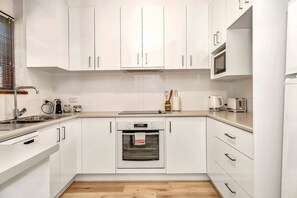 Whip up a quick breakfast or prepare a gourmet meal in the fully-equipped kitchen, complete with modern appliances. 
