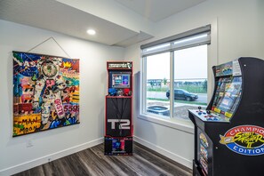 Unwind with gaming fun in the bonus room featuring 2 Arcade 1up machines—fun for all ages