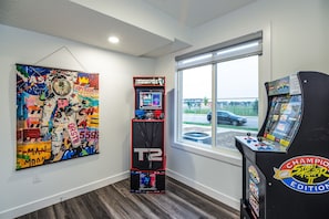 Unwind with gaming fun in the bonus room featuring 2 Arcade 1up machines—fun for all ages