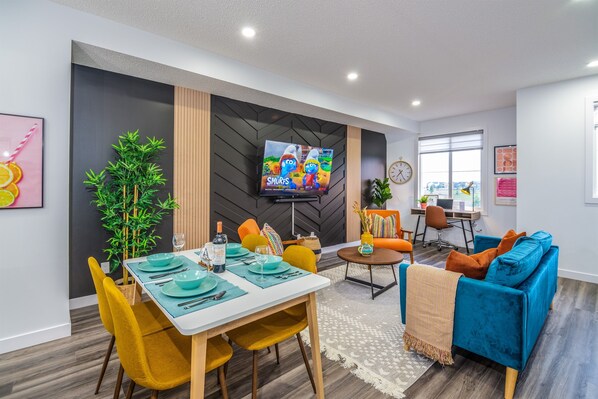 Enjoy meals together at the dining table or the convenient seating island in this stylish, functional kitchen space