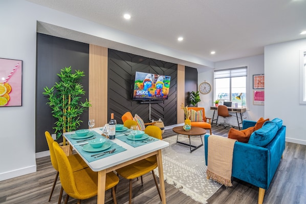 Enjoy meals together at the dining table or the convenient seating island in this stylish, functional kitchen space