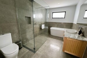 The main bathroom, has a huge deep bath, large shower, and plenty of room